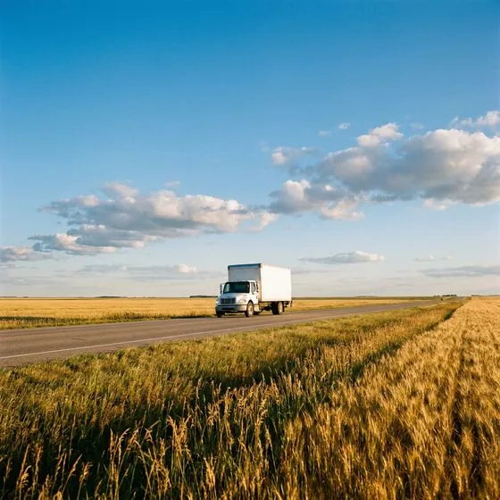 Right Way Logistics truck on a Manitoba highway for a long-distance move